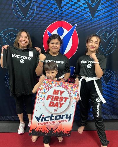 A mom and kids celebrate a first day